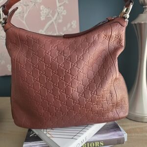 Gucci Embossed Leather Hobo Bag in Brown